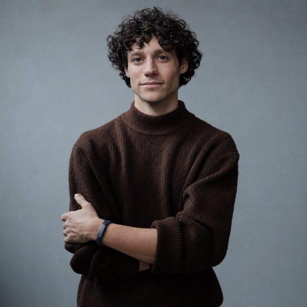 Wearing the Larkin band, arms crossed
