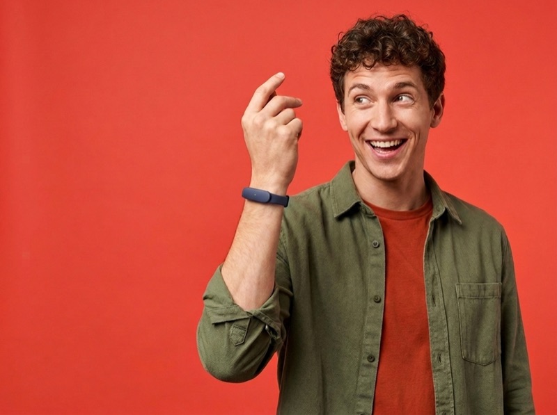 An energetic young man mid-idea, wearing the slim navy Larkin wristband