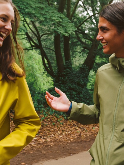 Two friends mid-conversation on a walk