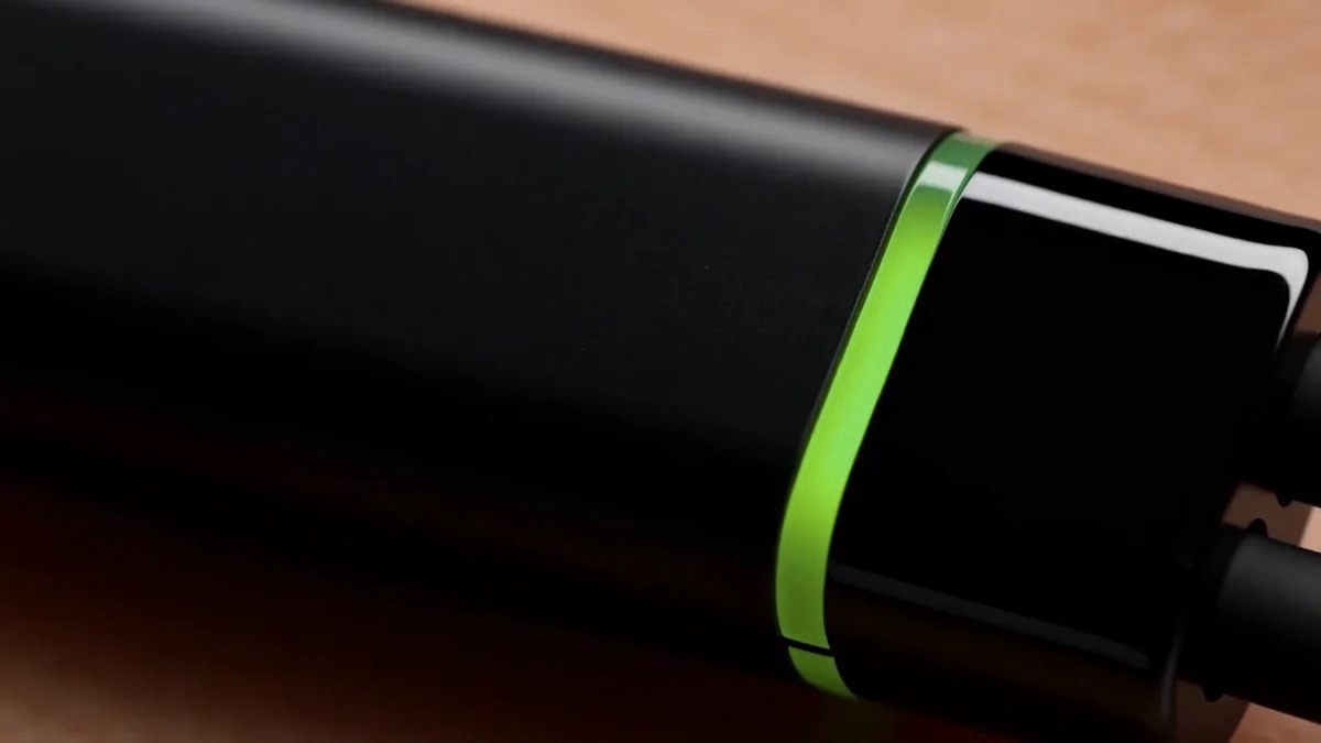 Close up of the module, its ring glowing lime